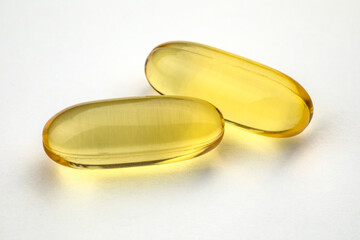 Omega 3 capsules on white background. Health care concept.