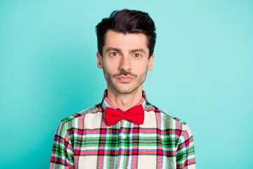Fototapeta premium Photo of calm focused guy look camera serious face wear checkered shirt tie isolated blue color background
