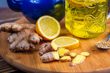Ingredients to prepare a ginger and lemon infusion. Concept of natural medicine and homeopathy