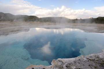 Hot water pool at Old Faithful geothermal area in Yellowstone National Park, Wyoming, USA