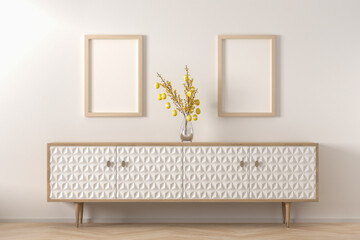 Interior design - sideboard with a glass vase of forsythia twigs with easter eggs hanging on them....