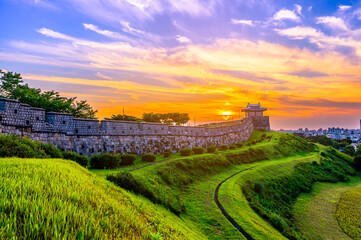 Fototapeta na wymiar Hwaseong Fortress in Sunset, Traditional Architecture of Korea at Suwon, South Korea.