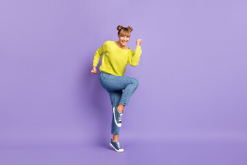 Full length body size view of pretty cheery girl jumping rejoicing success attainment isolated over pastel violet color background