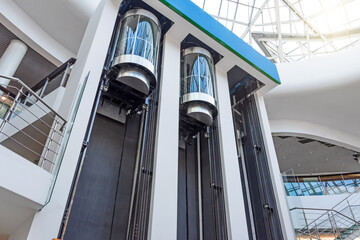 Elevators with counterbalanced concrete blocks, construction of an elevator mechanism in a shopping...