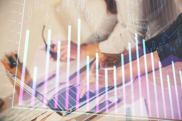 Multi exposure of woman hands typing on computer and financial chart hologram drawing. Stock market analysis concept.