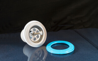 Plastic siphon for sink on black background