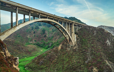 Bixby Creek Bridge on Highway One on the US West Coast heading south to Los Angeles, Big Sur, California, beautiful scenery, cliffs, Pacific Ocean. Concept, vacation, tourism, postcard photography and
