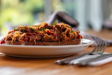 Toast (fried bread) with meat mixture. Delicious food. Meat toast with cheese. Ready to eat.