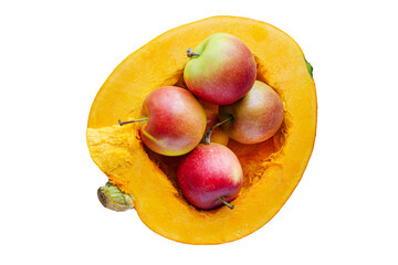Red ripe apples lie in half a pumpkin like in a vase. Isolated