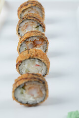 Fried hot sushi rolls isolated on white background