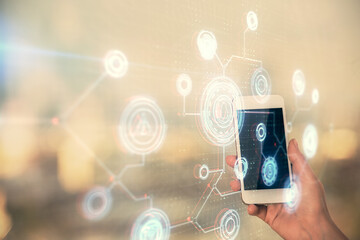 Double exposure of technology sketch hologram and woman holding and using a mobile device.