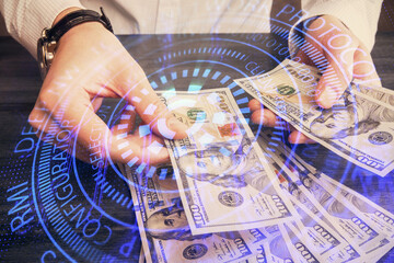 Double exposure of technology drawing hologram and us dollars bills and man hands. Data concept