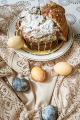 Obraz na płótnie Canvas Sliced Easter cake and Easter eggs