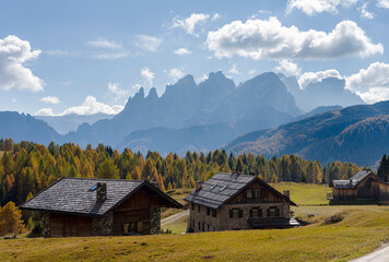 Fototapeta na wymiar View towards Pale di San Martino, Focobon mountain range, in the Dolomites of Trentino, seen from alpe Fuciade in the southern Marmolada range. Italy.