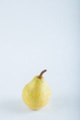 Ripe yellow pear on a white background