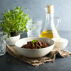 Homemade beef chili con carne with sour cream