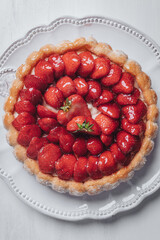 Delicious fresh Charlotte cake with strawberries