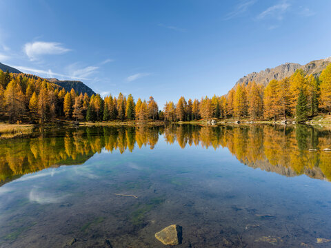 Lago San Pellegrino (Lech de San Pelegrin) during fall at Passo San Pellegrino in the Dolomites. Italy.