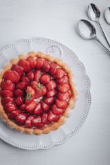 Delicious fresh Charlotte cake with strawberries
