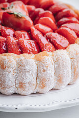 Delicious fresh Charlotte cake with strawberries