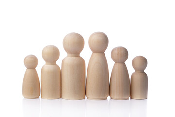Group of wooden toy people standing together with speech bubble. Family conceptual