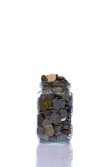 Jar full of coins on white background