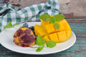Homemade mango blueberry sorbet garnish with mint leaf