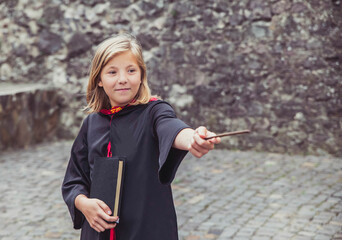 young sorceress in the castle conjuring by magic wand