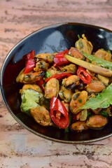 Oseng Kerang Saus Tiram, Indonesian food. Stir-fried mussels with oyster sauce, soy sauce, lemongrass, bayleaf, ginger, garlic and chili.