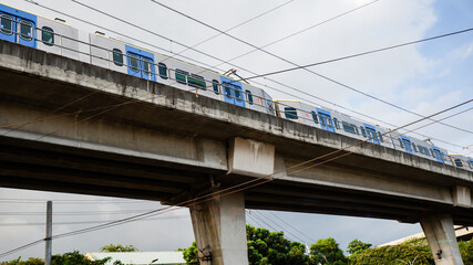 Fototapeta premium Light Railway Transit LRT in the Philippines - Elevated Train Railway Street Photo