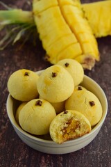 Indonesian pineapple tart cookies or Nastar served to celebrate Idul Fitri or Eid al Fitr. Blurred background