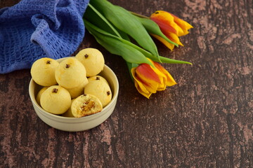 Indonesian pineapple tart cookies or Nastar served to celebrate Idul Fitri or Eid al Fitr. Wooden background
