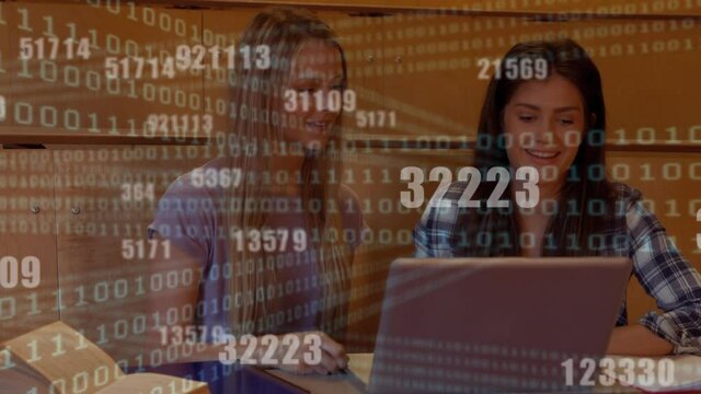 Binary coding data processing against two caucasian female students using laptop