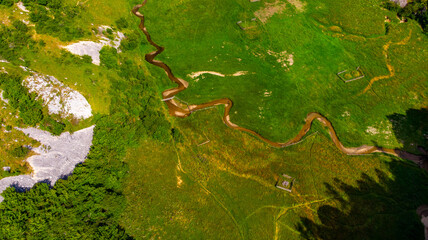 pastures and green trees seen from the rock where we climbed