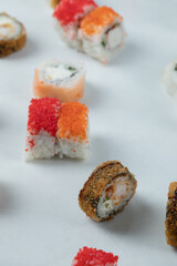 Sushi rolls with mixed ingredients isolated on white background