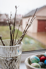 Willow branches in a vase on the windowsill