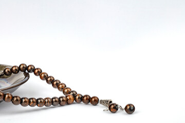 Ramadan concept with prayer beads and plate
