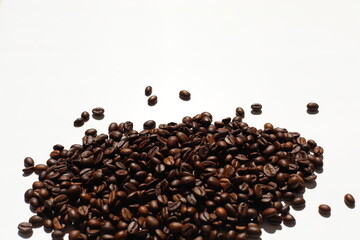 Textured background with robusta and arabica coffee beans closeup. Every day, people drink aromatic strong espresso in the morning. A popular world tradition in every country. Macro view backdrop
