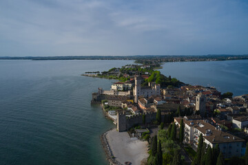 The historical part of the city of Sirmione on the background of Colombare Lake Garda Italy