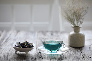 Blue pea flower juice on wooden table