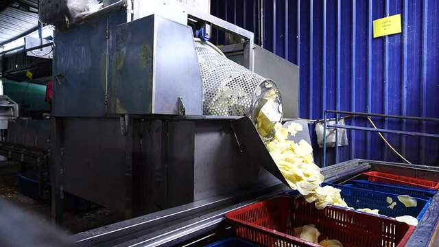 A factory that making cassava chip from washing the material, slicing, frying till packing at Tanjung Sepat, Malaysia.