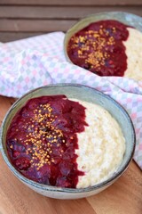 Breakfast oatmeal porridge with berry sauce and bee pollen
