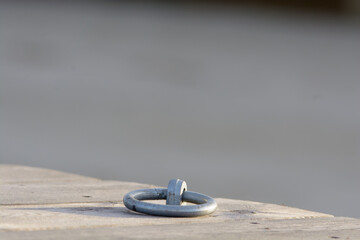 Fototapeta na wymiar closeup of an new mooring ring mounted on the boardwalk