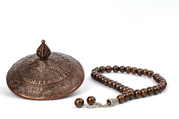 Ramadan concept with prayer beads and plate