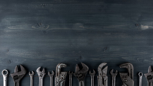 Plumbing Industrial Template. Grey and Blue Background with different tools. Copy space