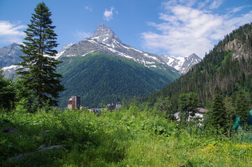 Fototapeta na wymiar Scenic view of Belalakaya mountain (3861 m) from Dombay. Nature and travel. Russia, North Caucasus, Karachay-Cherkessia