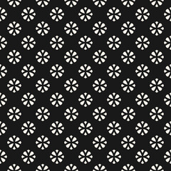 Vector geometric floral seamless pattern. Simple monochrome ornament with small flower silhouettes, diamonds. Abstract ornamental black and white background. Dark repeat design for decor, print, cover