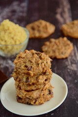 Quinoa cashew chocolate cookies on wooden background