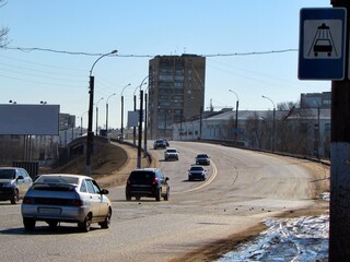 Cars drive along the asphalt road from the city. Automobile route in Russia 