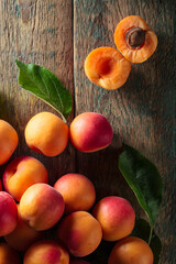 Fresh apricots on a wooden table.